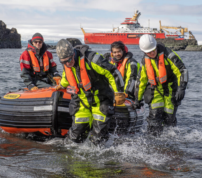 A geological field party shore landing an King George Island, Antarctica