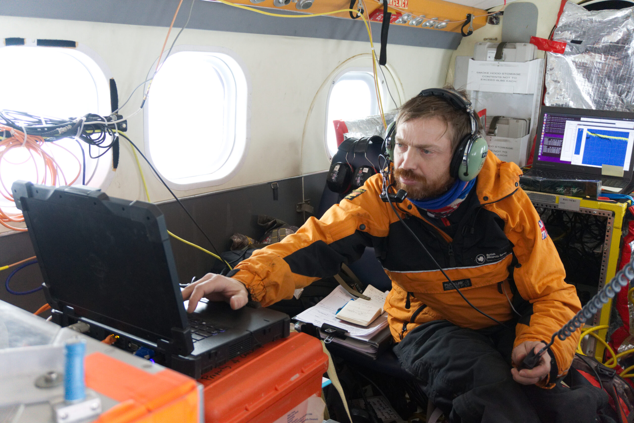 Airborne Survey Team working onboard a BAS Twin Otter in Antarctica