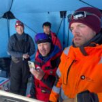 A group of people posing for the camera