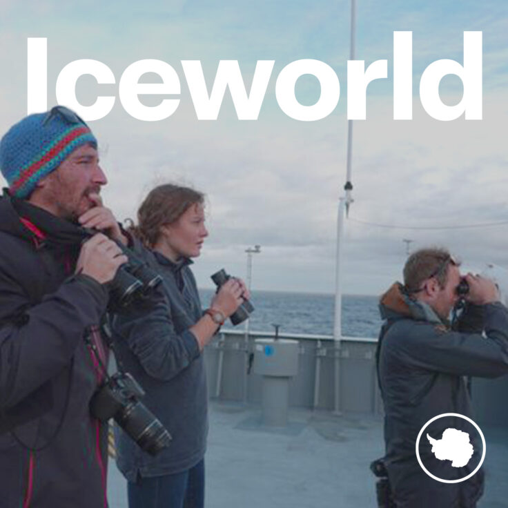 A group of people standing in front of a microphone