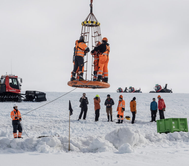 staff heading to work from SDA using a wor georgie to be lifted safely from the ship