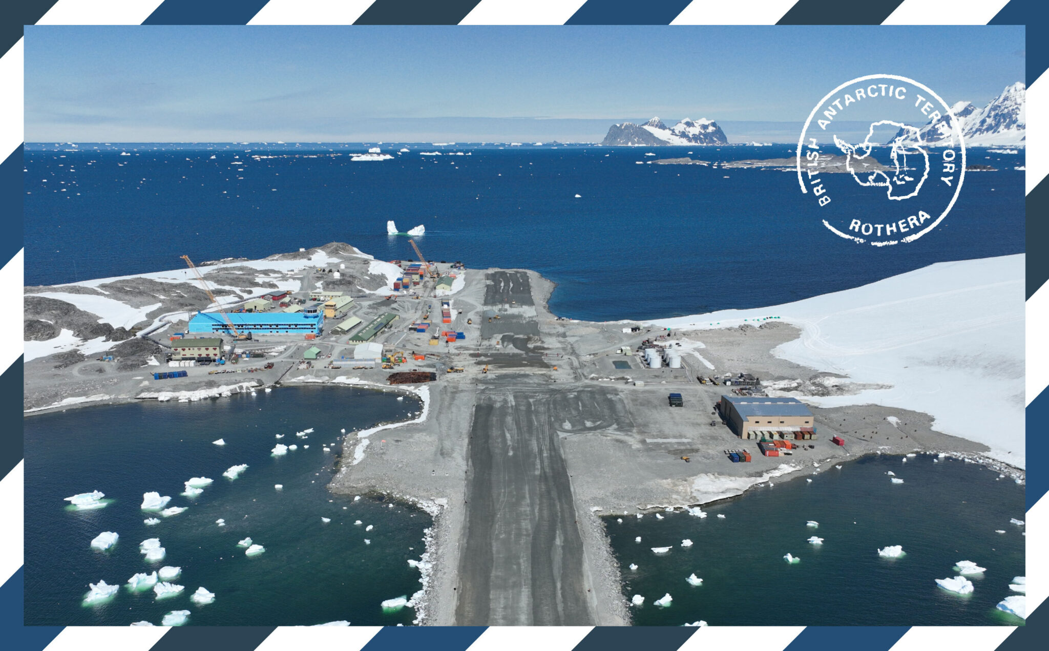 A large building surrounded by water and a short runway. There is icebergs in the water.