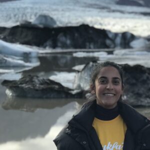 A person standing in front of water