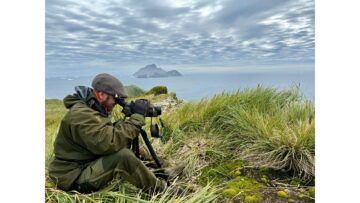 George Day sat on Bird Island observing wildlife