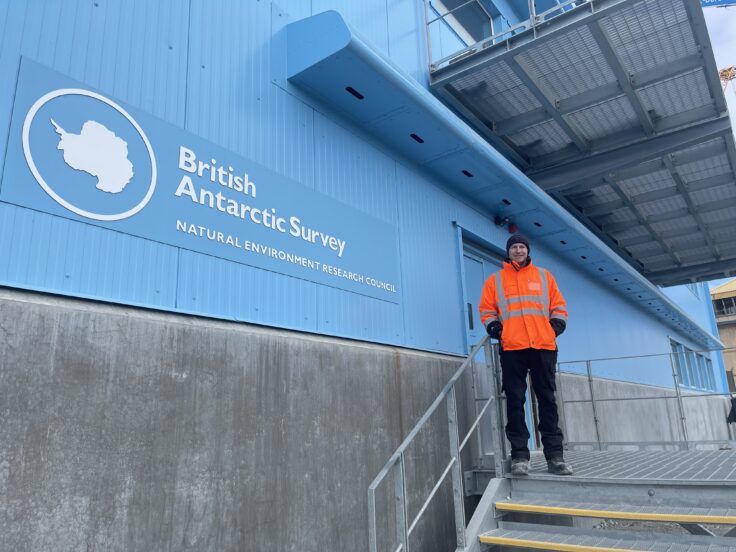 A man standing in front of a building