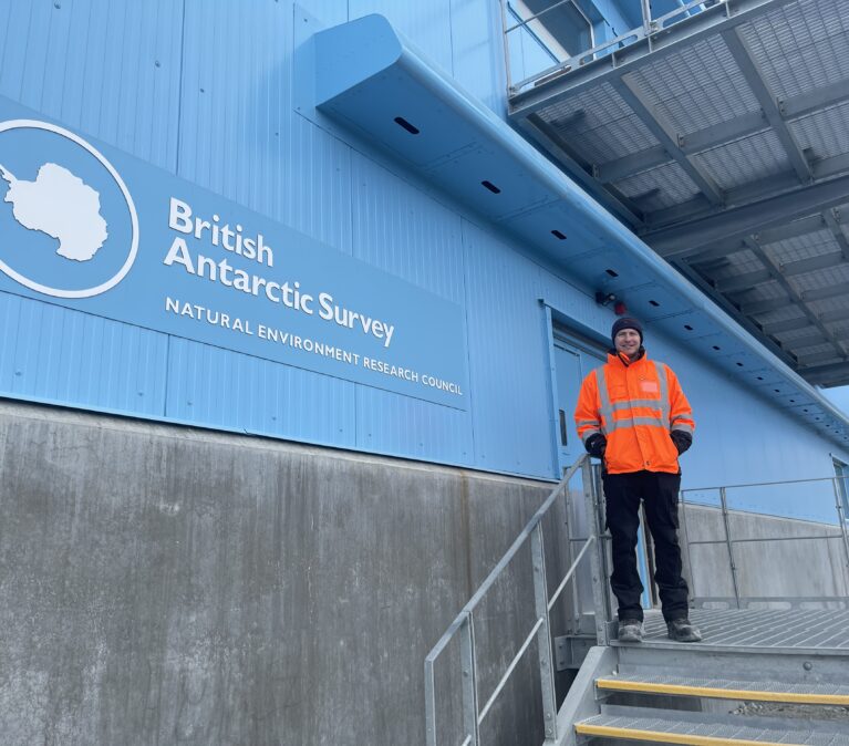 A man standing in front of a building