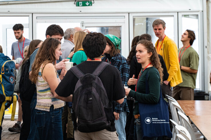 A group of people standing in a room