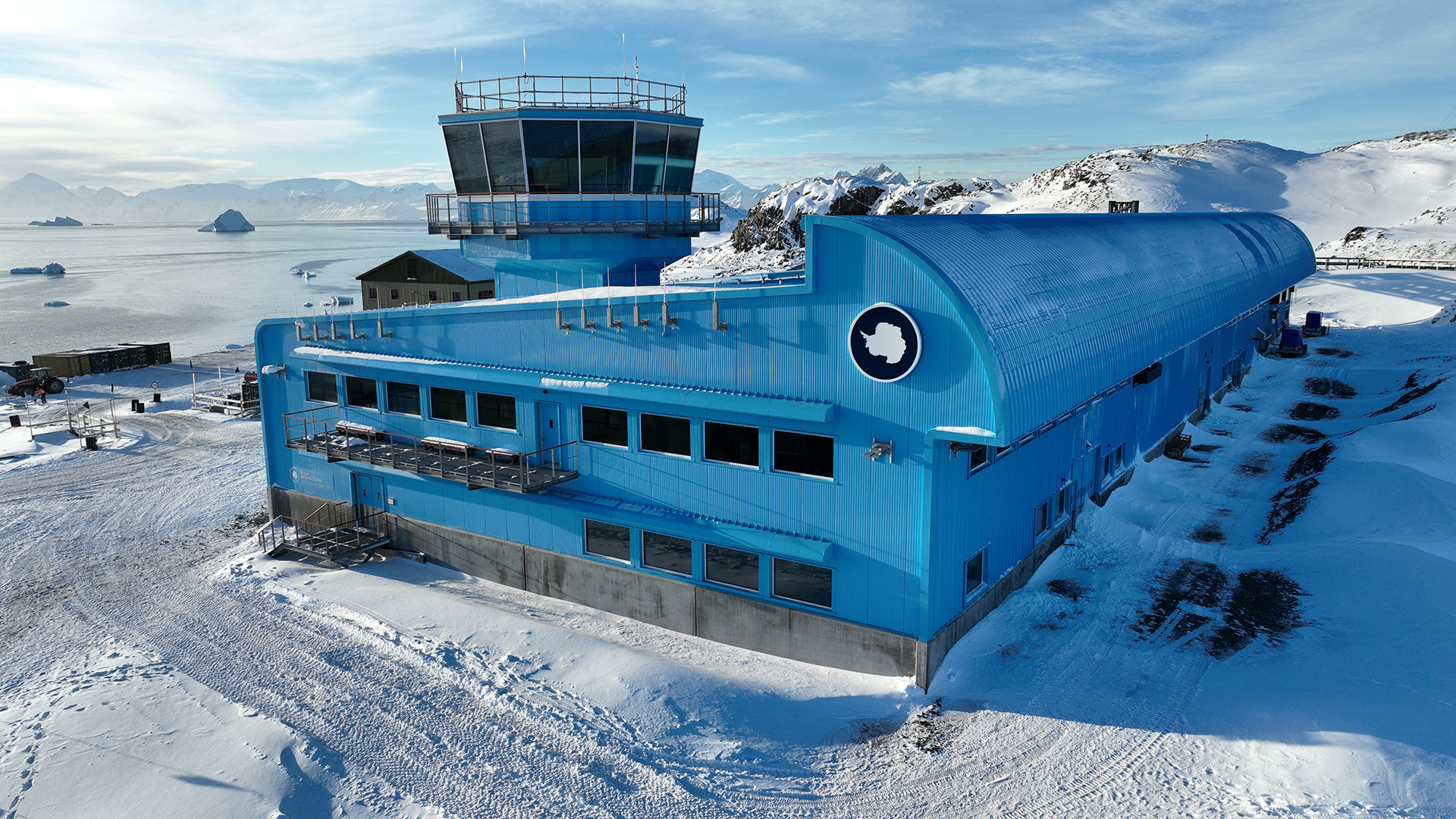 A large blue building in the snow